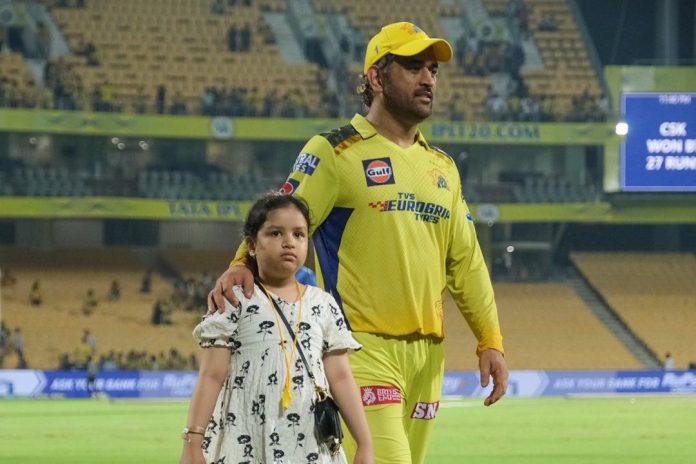 Ziva runs on to the field to greet her father, MS Dhoni, after the victory of CSK